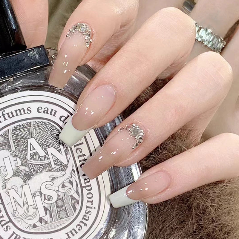 Artful stiletto nails with rhinestone accents Bowlift