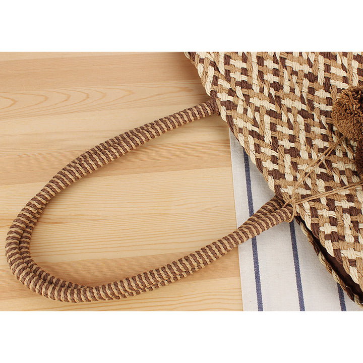 Summer wicker handbag with pom poms Bowlift