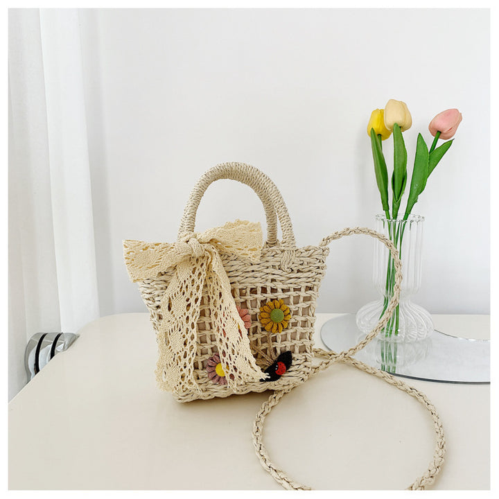 Playful basket bag with floral appliqués Bowlift