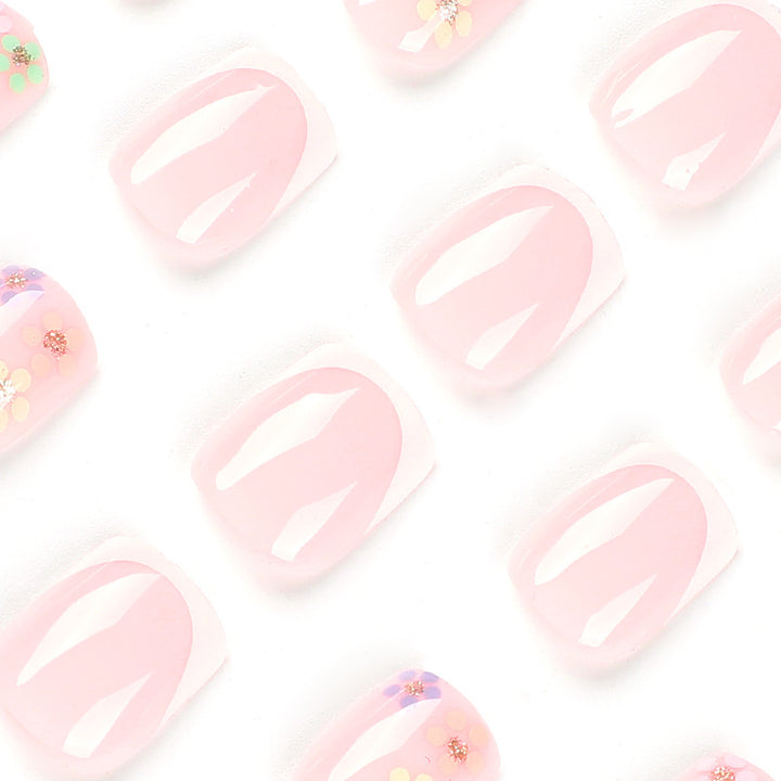 Artistic nail art with floral accent and elegant French tip Bowlift