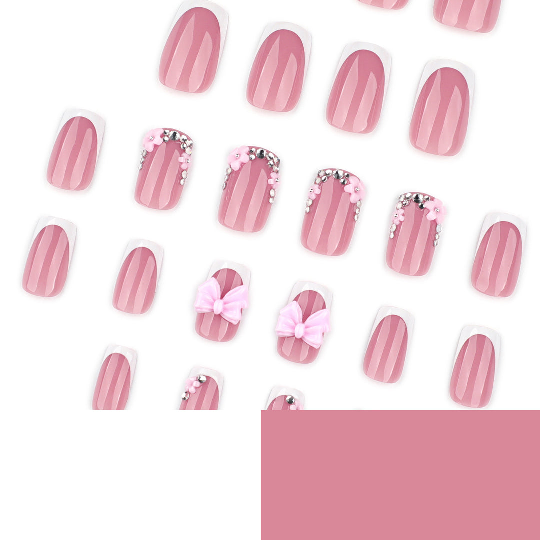 Artful nail extensions with sparkling accents and bow decorations Bowlift