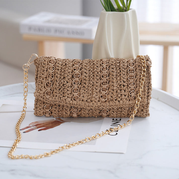 Clutch with chain shoulder strap and handcrafted macrame closure Bowlift