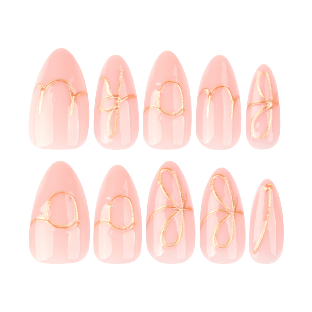 Creative nail art with golden accents and trendy lettering Bowlift