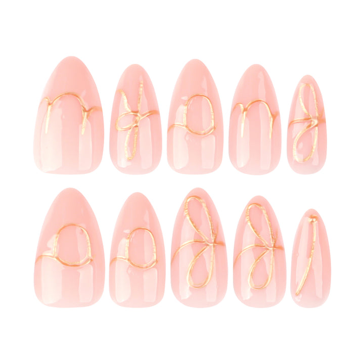 Creative nail art with golden accents and trendy lettering Bowlift