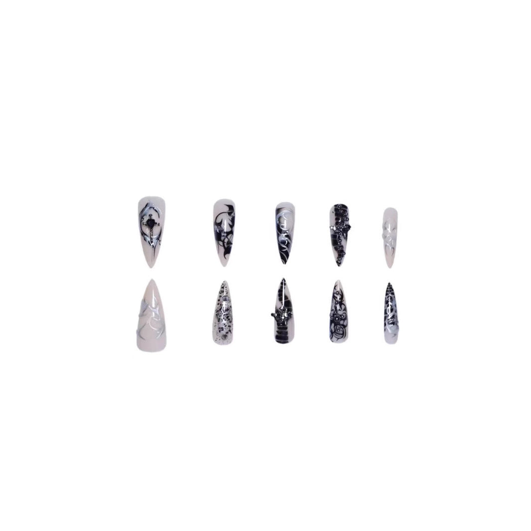 Artistic Stiletto Nail Enhancements with Intricate Patterns Bowlift