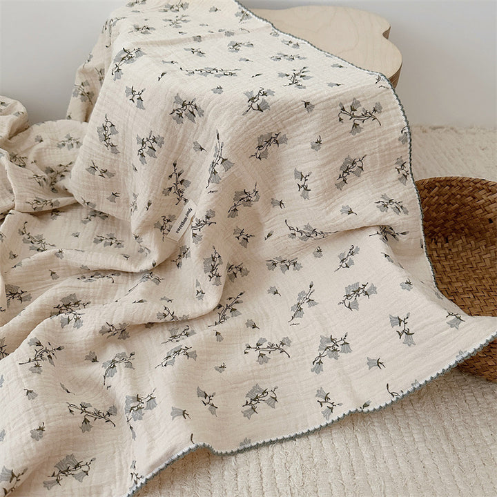 Unisex Muslin Blanket with delicate floral design and elegant ruffles Bowlift