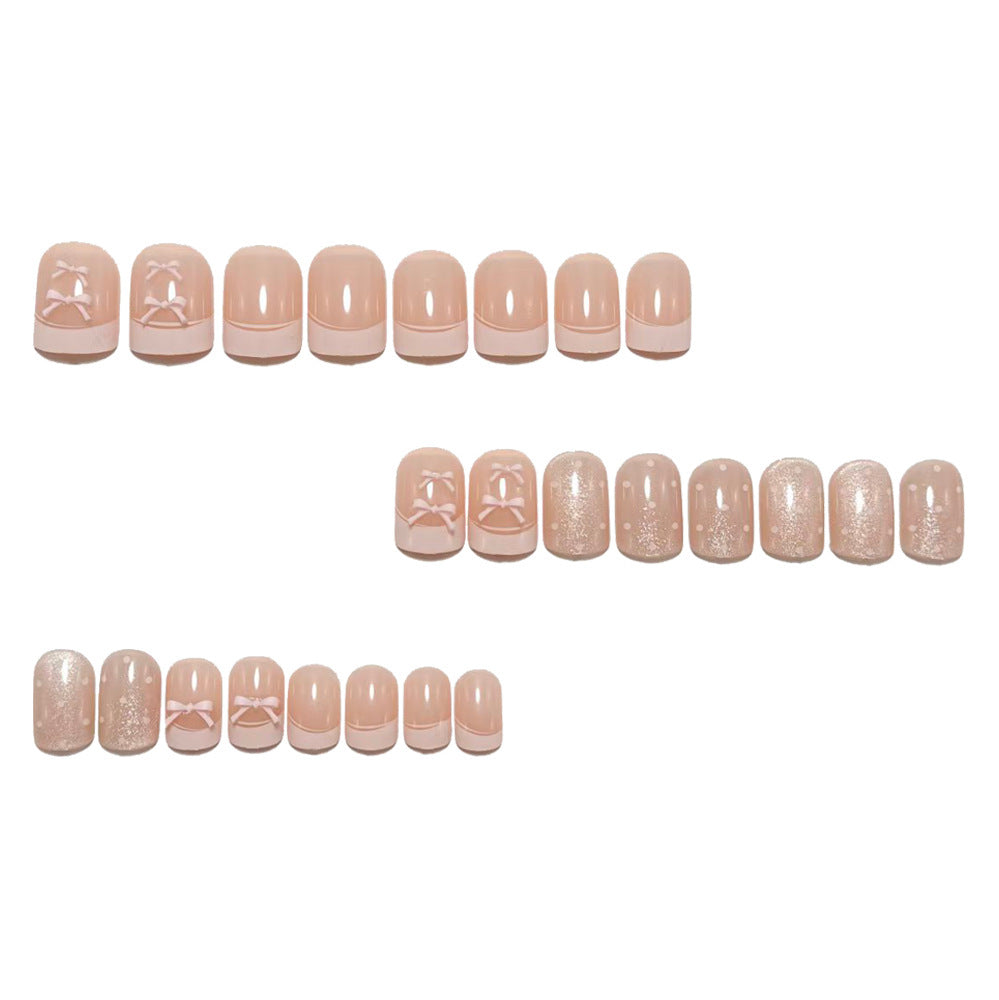 Artificial nails with delicate bow and glitter motifs Bowlift