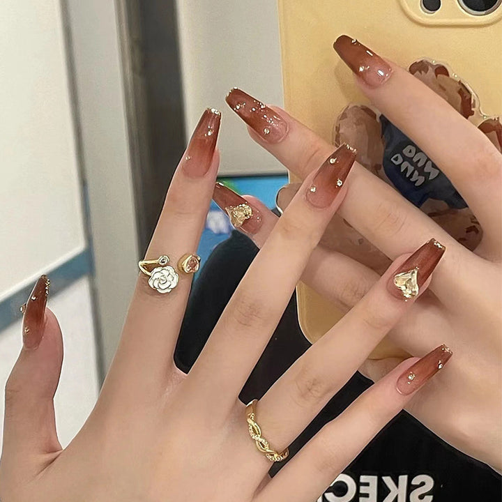 Glamorous artificial nails with sparkling accents Bowlift