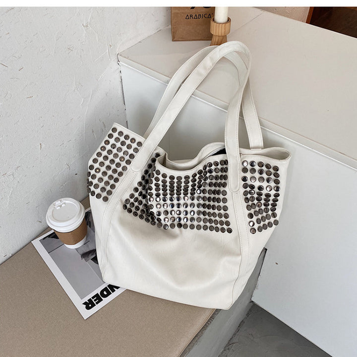 Fashionable shoulder bag with stylish rivet details Bowlift