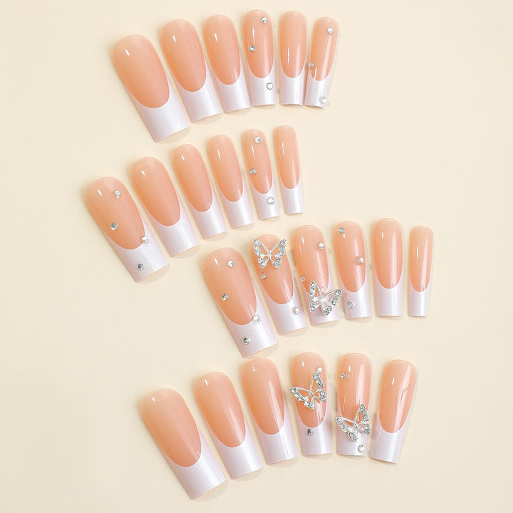 Artificial nail set with luxurious glitter and delicate floral designs Bowlift