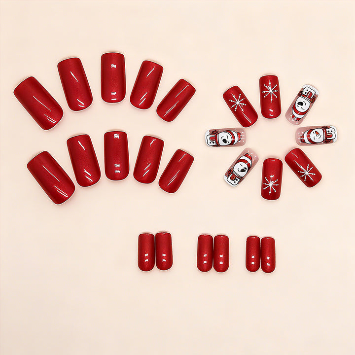 Artificial nail set with festive snowman design and glitter accents Bowlift