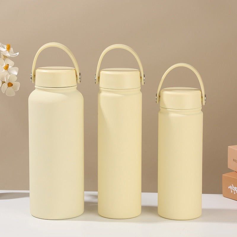 Women's double-walled insulated water bottle with practical carrying handle Bowlift