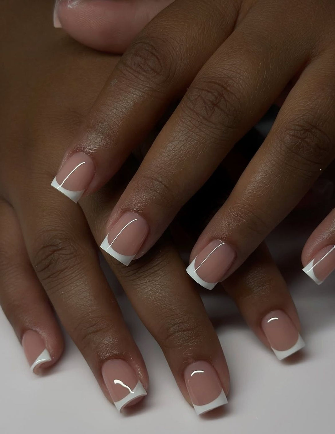 Artificial nails in elegant French tip design Bowlift