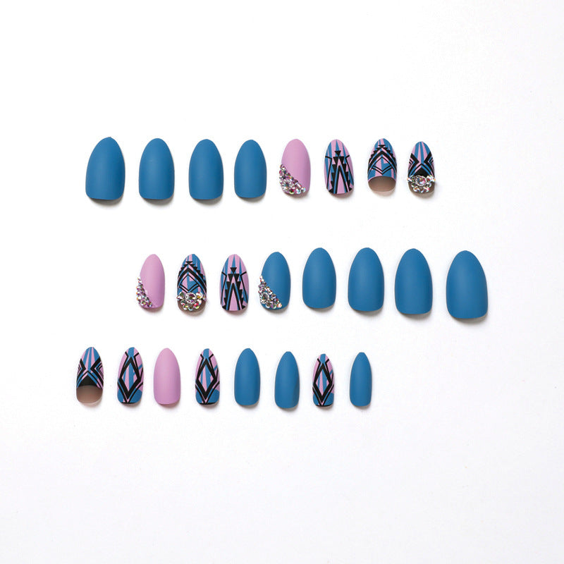 Artful stiletto nails with modern geometric designs and rhinestone embellishments Bowlift