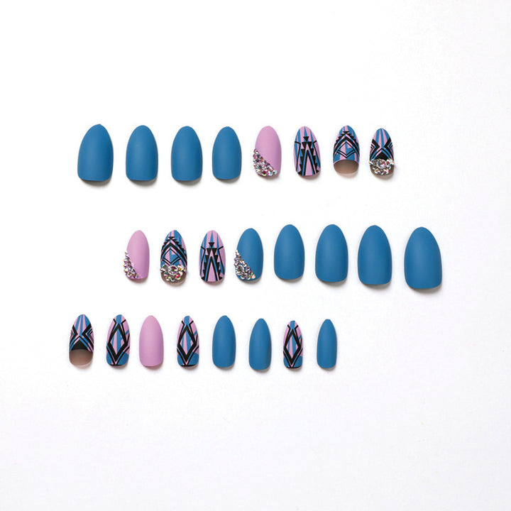 Artful stiletto nails with modern geometric designs and rhinestone embellishments Bowlift