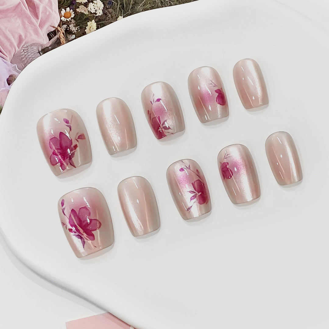 Artificial nail tips with floral accents Bowlift