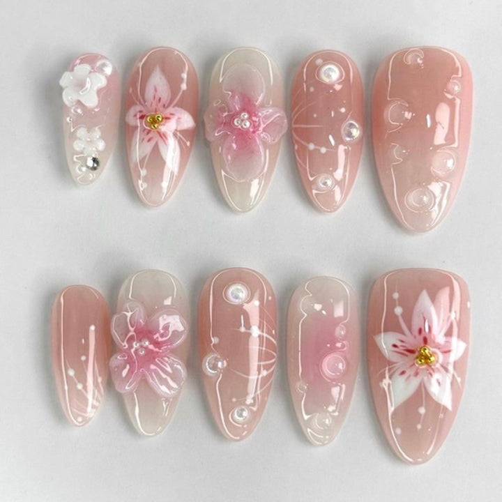 Artful stiletto nails with elegant floral design and glitter details Bowlift