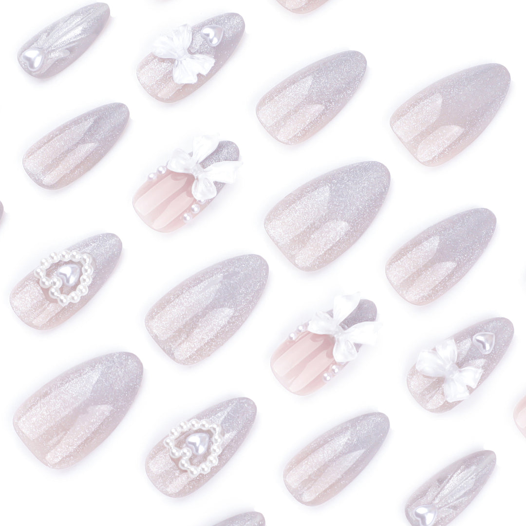 Artful nail decoration with pearl and bow accents Bowlift