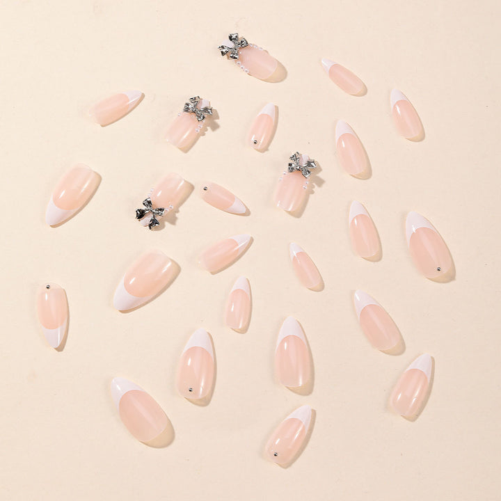 Elegant Stiletto Nail Art with Rhinestone Accents Bowlift