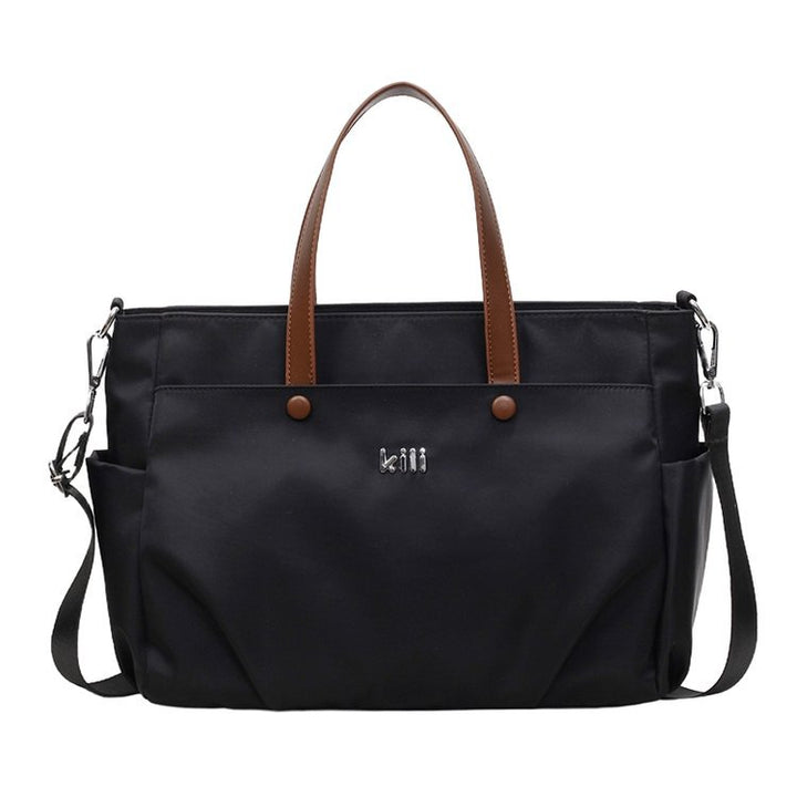 Shopping bag with comfortable carrying system and practical outer pockets Bowlift
