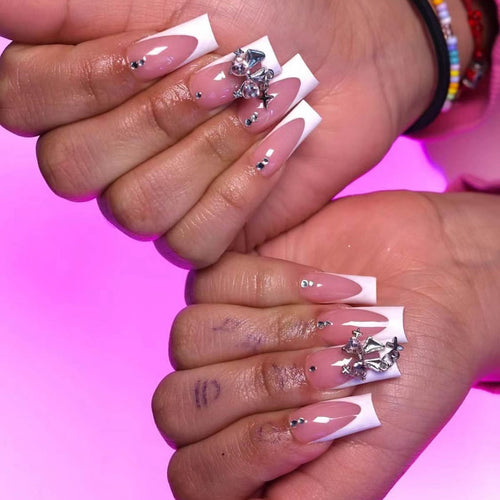 Artificial nail set with luxurious French tips and elegant embellishments Bowlift
