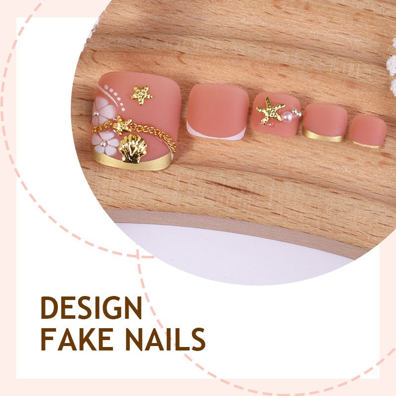Artificial nail set with elegant, floral accents and golden decorations Bowlift