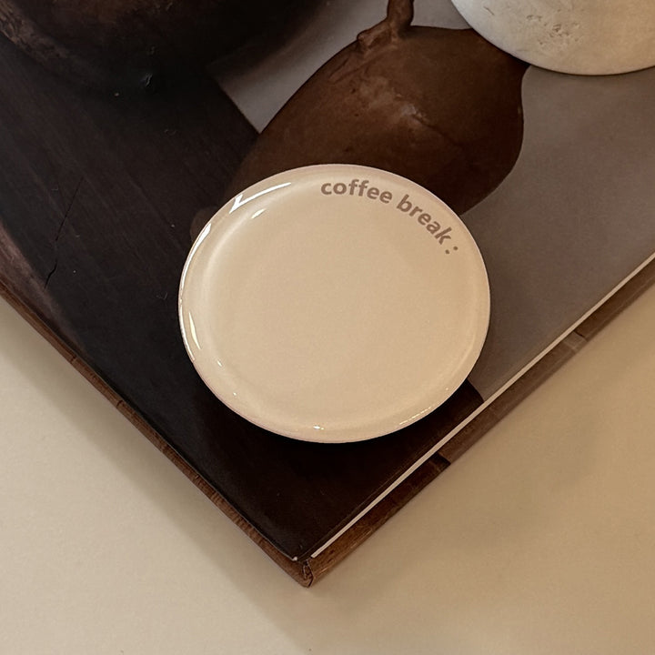 Decorative ceramic coaster with the inscription Bowlift