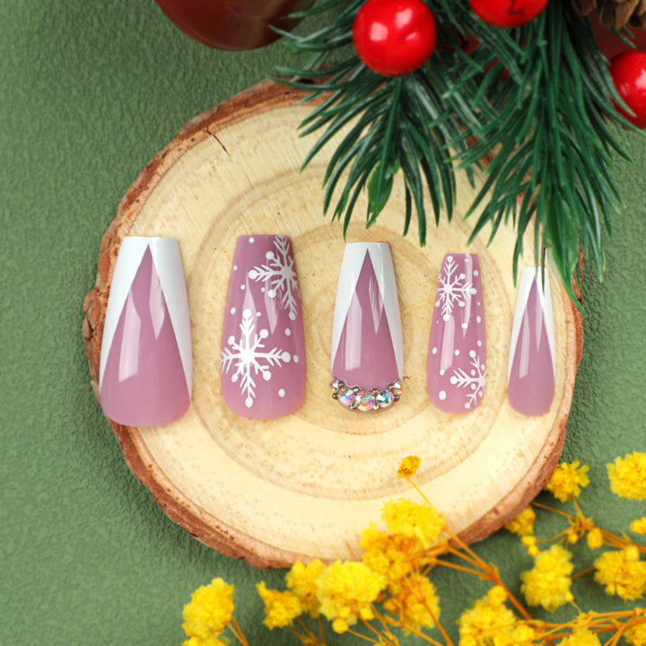 Artistic Nail Extensions with Snowflake Design and Glitter Accents Bowlift