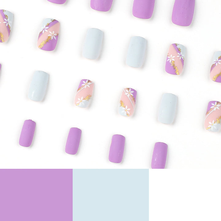 Artistic nail designs with floral motifs and glitter accents Bowlift