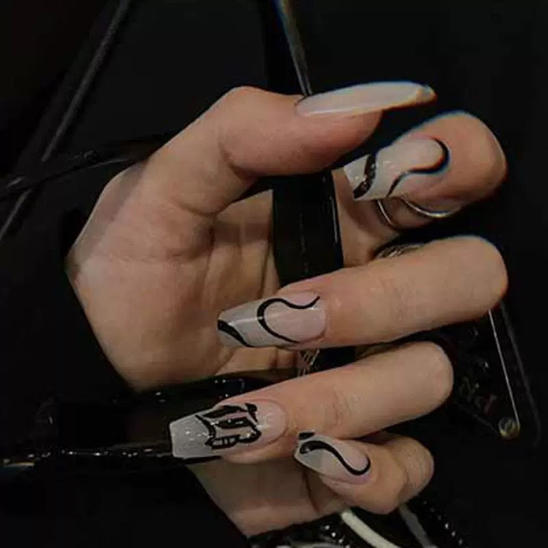Acrylic nail set with elegant design and creative accents Bowlift