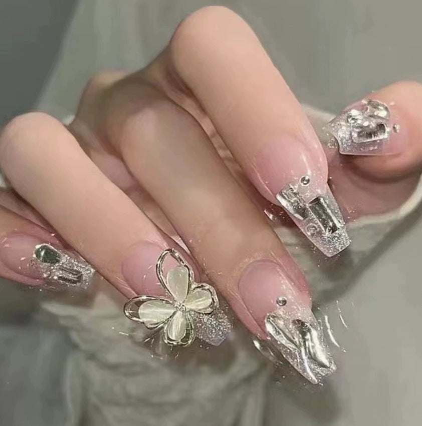 Elegant nail design with pearl embellishment Bowlift