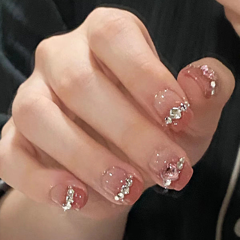 Glamorous nail art with rhinestone details Bowlift