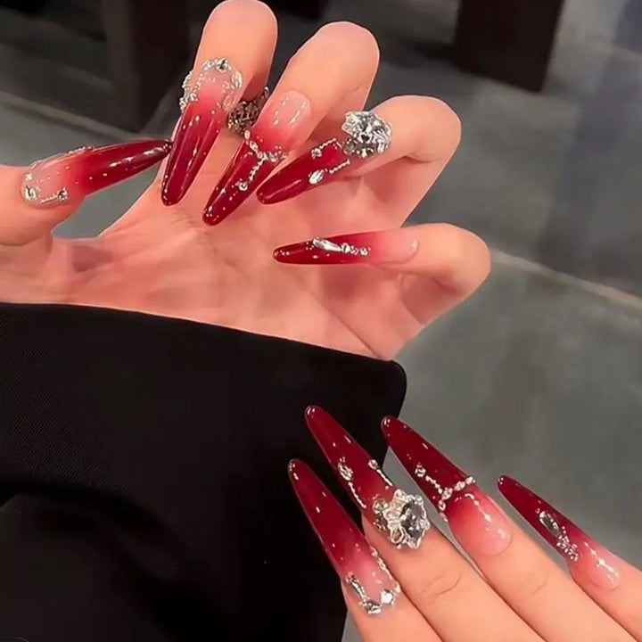 Artificial nails with elegant glitter and jewelry accents Bowlift