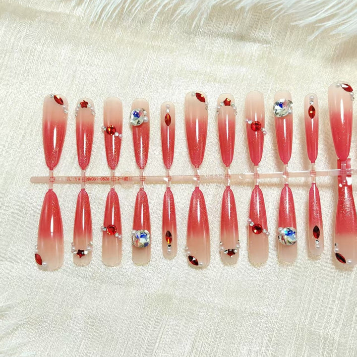 Artificial nails with glamorous glitter and rhinestone embellishments Bowlift