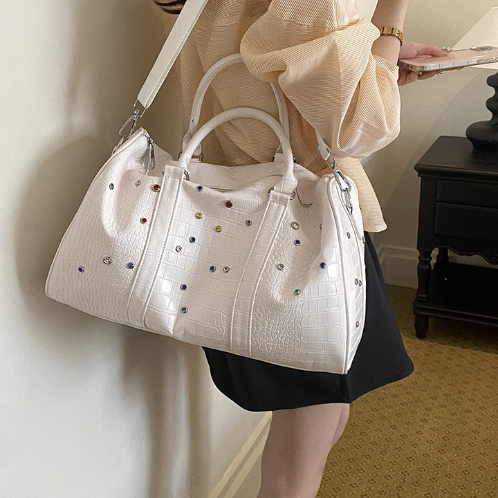 Fashionable travel bag with structured surface and versatile interior Bowlift