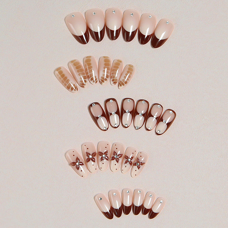 Artificial nails with elegant motif designs Bowlift