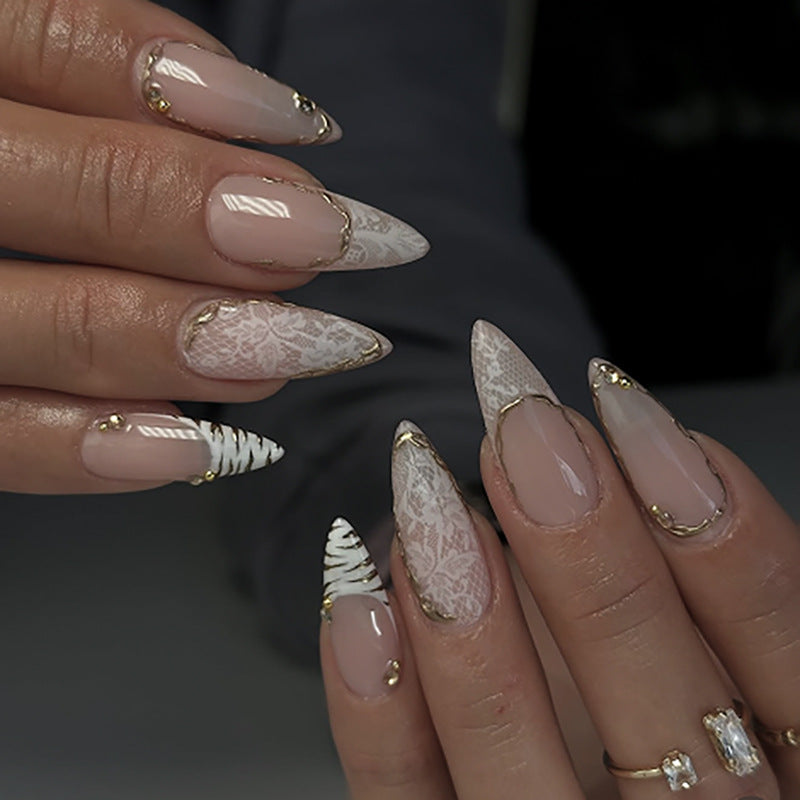 Glamorous stiletto nails with elegant star design Bowlift