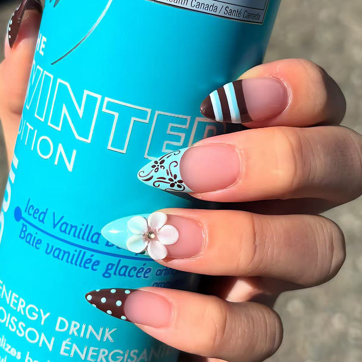 Artificial nails with creative floral design and elegant accent colors Bowlift