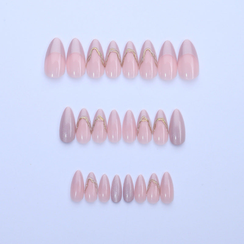Acrylic nail set with glamorous tips and golden accents Bowlift
