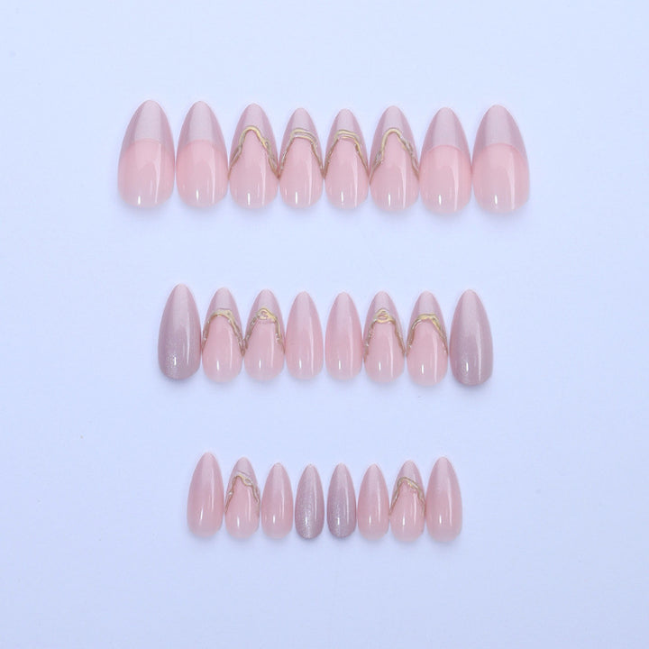 Acrylic nail set with glamorous tips and golden accents Bowlift