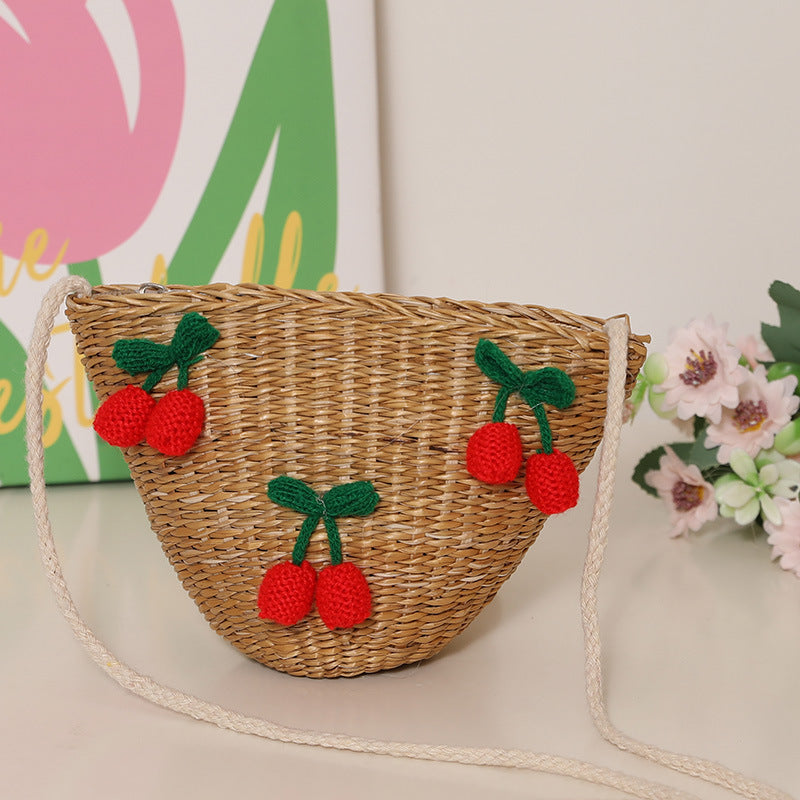 Playful straw shoulder bag with floral accents Bowlift