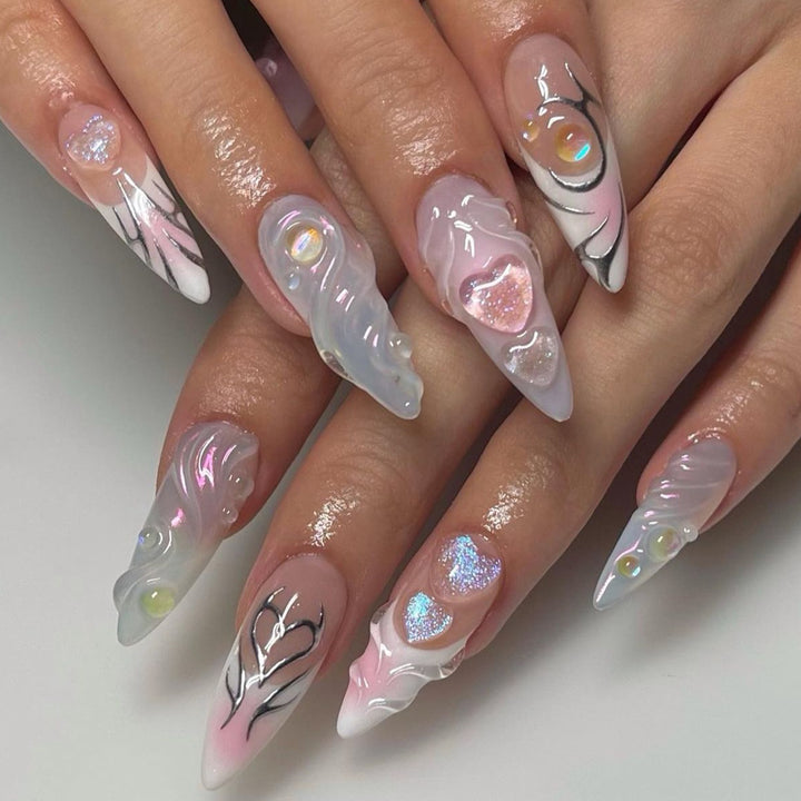 Artful nail extensions with two-dimensional design and glitter accents Bowlift