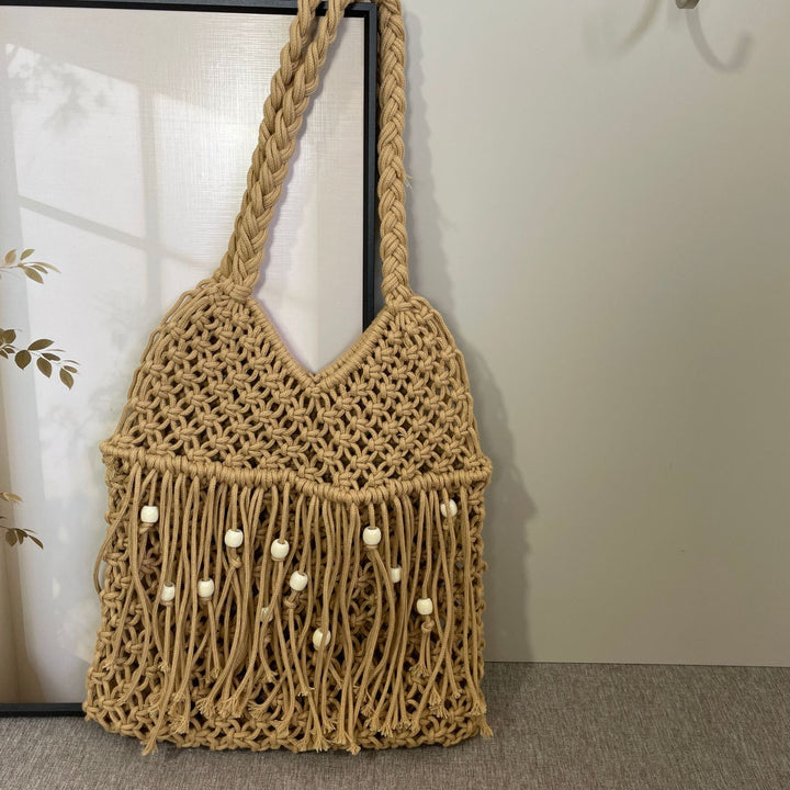 Macramé bag with long fringes and wooden beads Bowlift