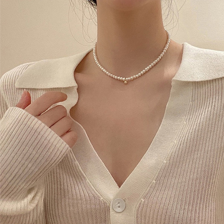 Delicate pearl necklace with elegant gold accent chain Bowlift