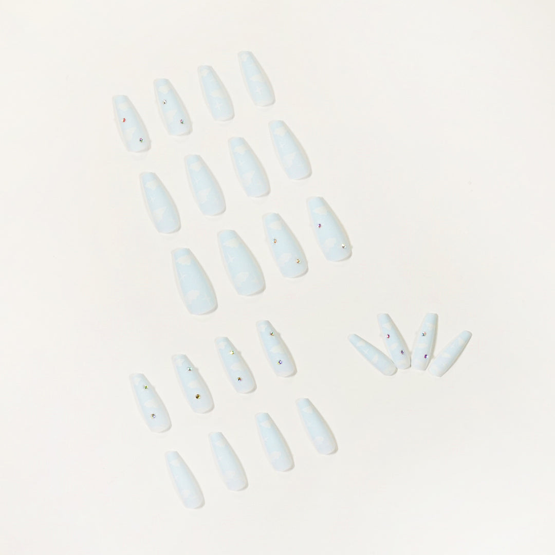 Creative nail art in cloud design with glitter accents Bowlift