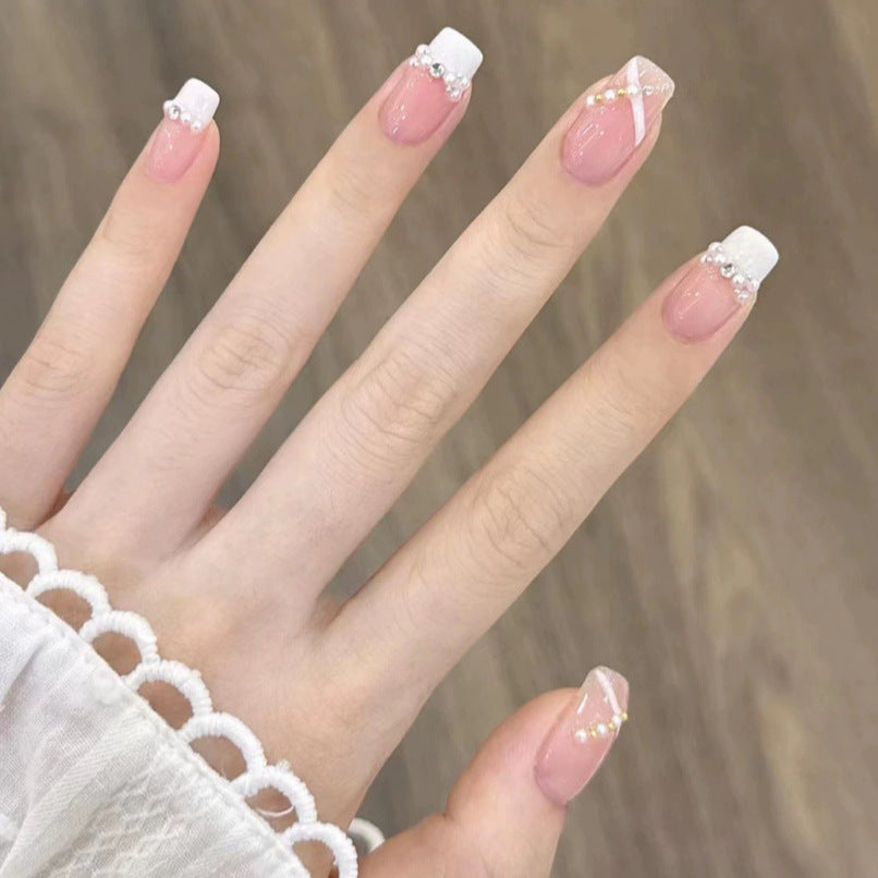 Elegant nail design with pearl embellishment Bowlift