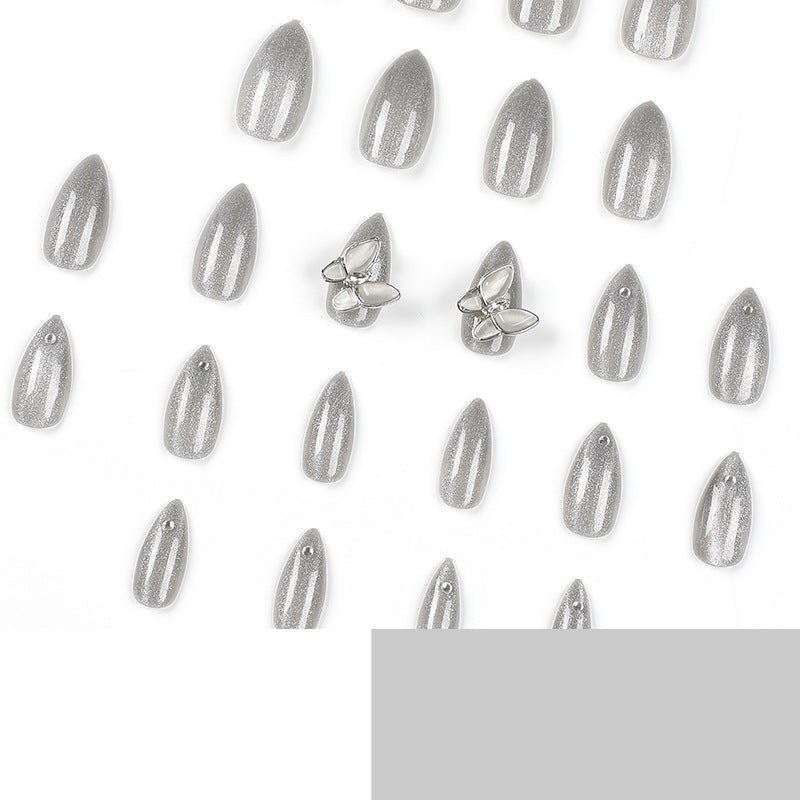 Glamorous stiletto nails with radiant glitter and elegant 3D design Bowlift