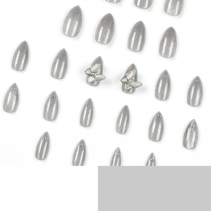 Glamorous stiletto nails with radiant glitter and elegant 3D design Bowlift
