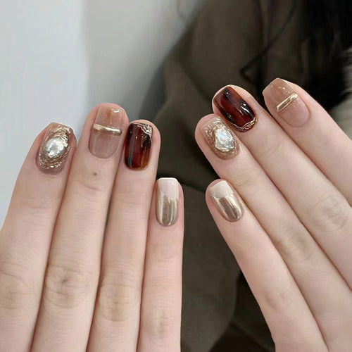 Elegant Nail Art Set with Unique Marble and Metallic Accents Bowlift