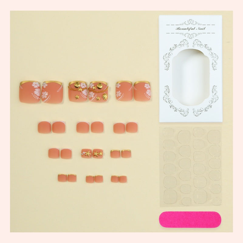 Artificial nail set with elegant, floral accents and golden decorations Bowlift